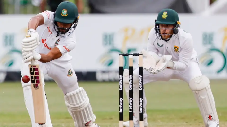 a group of men playing cricket